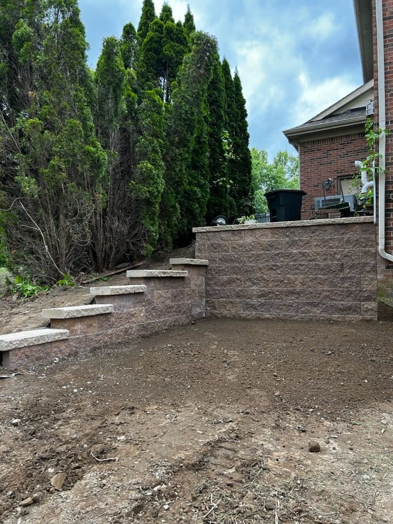 Backyard Transformation with Retaining Wall Installation image